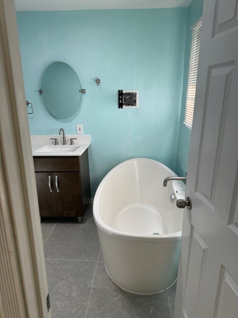 Double shower with built-in seats and wall niches.