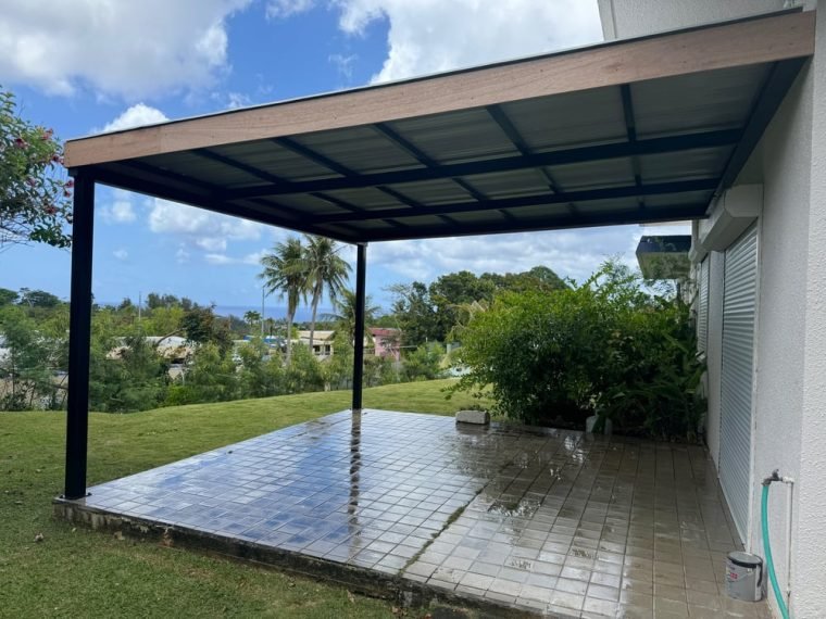 Steel canopy set over new concrete.