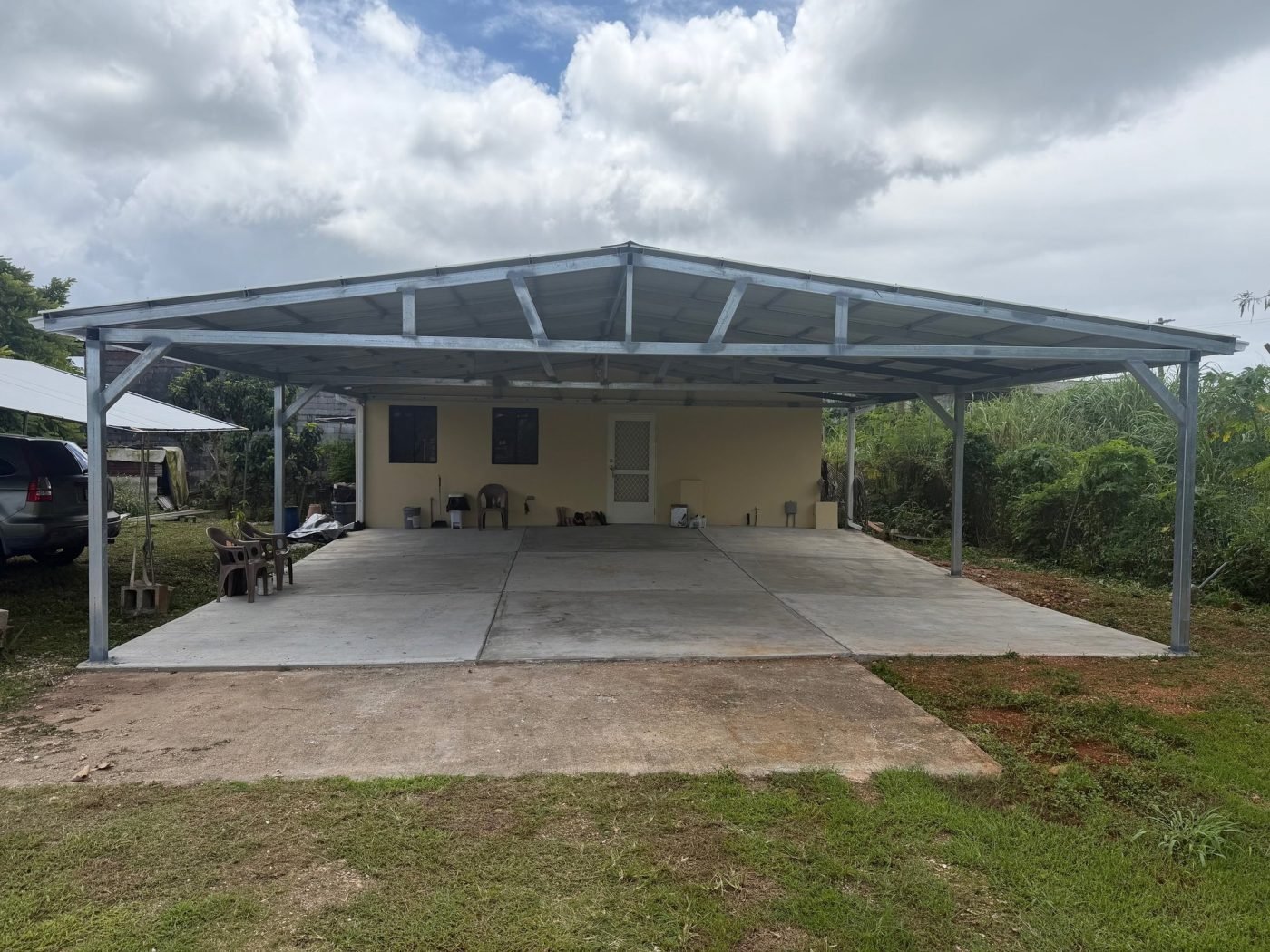 The finished 30 by 30 foot steel canopy over newly placed concrete