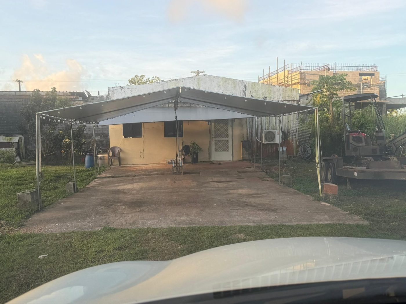 The property before work, with a deteriorated front elevation and no canopy